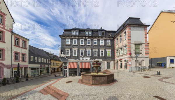 Market street with pharmacy fountain in Ilmenau, Thuringia, Germany