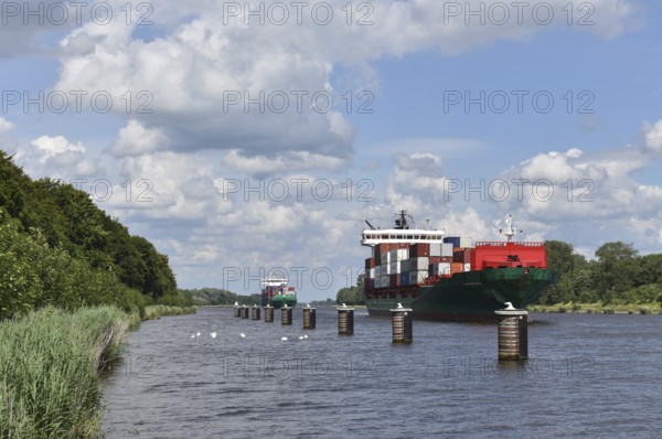 Container ships in a siding, siding area in the Kiel Canal, Kiel Canal, Kiel Canal, Schleswig-Holstein, Germany