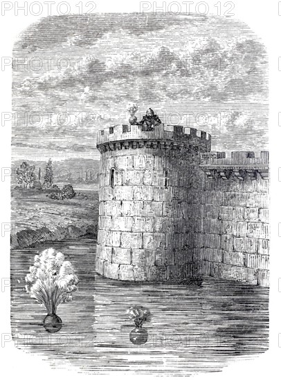 Detonating bullets, precursor of the depth charge, here being tested from a castle tower in a moat, 13th century, digitally enhanced reproduction of a 19th century model, historical, exact date unknown