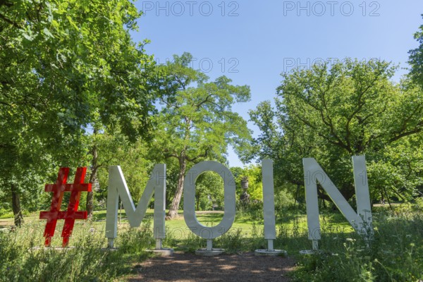 Hashtag Moin to greet you in the Bremen ramparts, formerly part of the city fortifications with ramparts and moat, today a park, history, nature experience, sunshine, Bremen, Germany