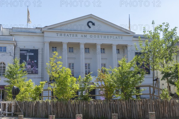 Theatre on Goetheplatz, theatre with neoclassical columned front, ramparts, eastern suburb, Ostertor district, Johann Wolfgang Goethe, historic square, reconstruction after WW II by architects Werner Commichau and Hans Storm, architecture, culture, leisure, trees, wooden fence, poster, Bremen, Germany