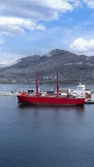 International shipping line transportation container cargo ship in Nuuk Port in Greenland