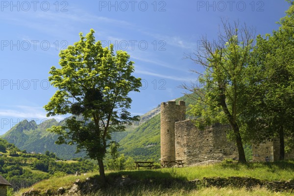 The ruins of the ChÃ¢teau Sainte-Marie castle in Esterre and the mountain landscape near Luz-Saint-Sauveur, Pyrenees, France