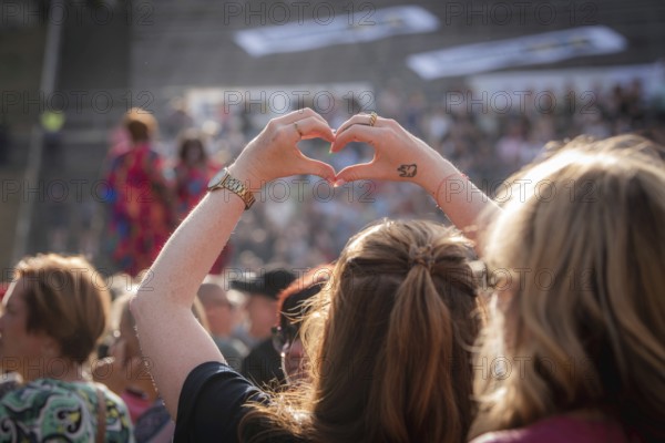 Hands formed into a heart at the Berliner Rundfunk 91.4 Open Air at the Berlin ParkbÃ¼hne Wuhlheide on 05.07.2025