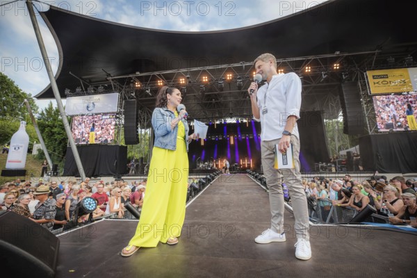 Simone Panteleit and Sebastian Oswald, presenters at the Berliner Rundfunk 91.4 Open Air at the Berlin ParkbÃ¼hne Wuhlheide on 5 July 2025