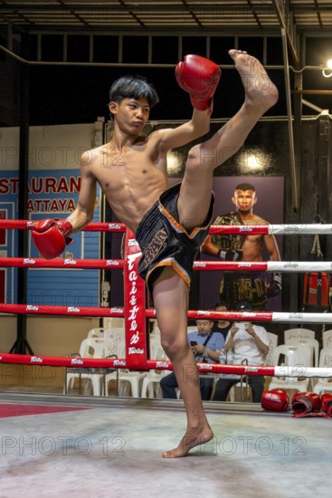 Thai boxing Muai Thai boxer in action, Pattaya, Thailand