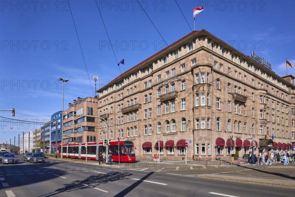 Le Méridien Grand Hotel Nuremberg, historical buildings, Marriott Hotels, lantern, tram, public transport, pedestrians as secondary motif, blue sky, cirrostratus clouds, intersection Königstorgraben with BahnhofstraÃŸe, Nuremberg, Middle Franconia, independent city, Bavaria, Germany