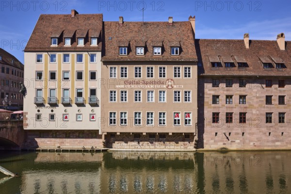 River Pegnitz, Spital-Apotheke, historical building, pharmacy, facade, window, reflections, water surface, blue sky, Spitalgasse, Nuremberg, Middle Franconia, independent city, Bavaria, Germany