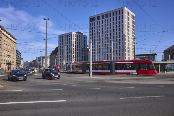 Traffic area, modern architecture, general development, tram, overhead lines, vehicles, lantern, blue sky, cirrostratus clouds, intersection Bahnhofsplatz with BahnhofstraÃŸe, Nuremberg, Middle Franconia, independent city, Bavaria, Germany