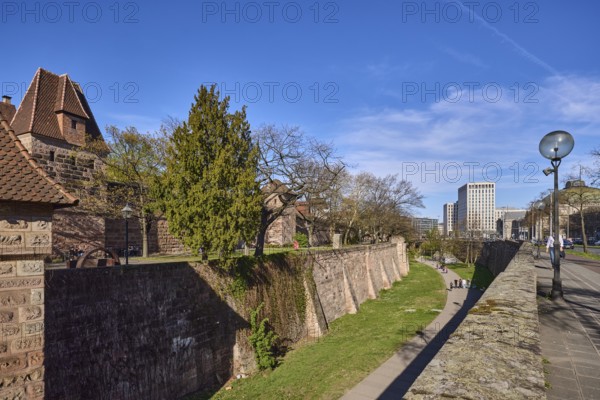 Old town, city fortification, city wall, tower, modern architecture, lantern, trees, lawn, blue sky, cirrostratus clouds, Frauentor wall, Frauentor moat, Nuremberg, Middle Franconia, independent city, Bavaria, Germany