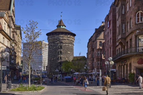 Frauentorturm, city fortification, round tower, pedestrian zone, historical buildings, modern architecture, lantern, trees, street, pedestrians as secondary motif, blue sky, cloudless, intersection KönigstraÃŸe with LuitpoldstraÃŸe, Nuremberg, Middle Franconia, independent city, Bavaria, Germany