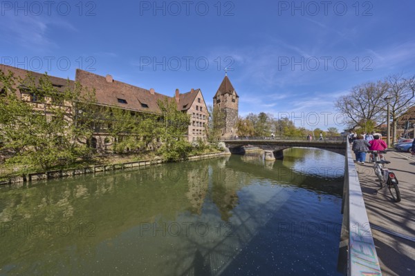 Schuldturm, river Pegnitz, bridge, historical buildings, house, trees, reflections, water surface, street, metal railing, pedestrian as secondary subject, super wide angle, blue sky, cirrostratus clouds, Unterer Bergauer Platz, HeubrÃ¼cke, Vordere Insel SchÃ¼tt, Nuremberg, Middle Franconia, independent city, Bavaria, Germany