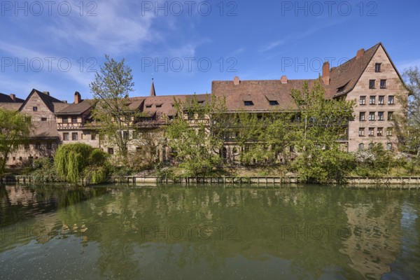 River Pegnitz, historical buildings, houses, trees, reflections, water surface, blue sky, cirrostratus clouds, Vordere Insel SchÃ¼tt, Nuremberg, Middle Franconia, independent city, Bavaria, Germany