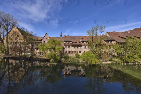 River Pegnitz, historical buildings, trees, symmetrical reflections, water surface, blue sky, cirrostratus clouds, Vordere Insel SchÃ¼tt, Nuremberg, Middle Franconia, independent city, Bavaria, Germany