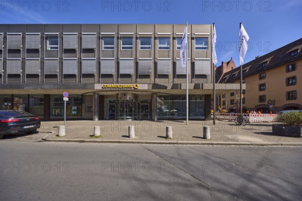 Commerzbank, modern architecture, flags, flagpoles, entrance area, barrier bollards, parking lane, vehicle, blue sky, cirrostratus clouds, alleyway Spitalgasse, Nuremberg, Middle Franconia, independent city, Bavaria, Germany