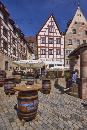 Zum Albrecht DÃ¼rer Haus, restaurant, outdoor area, gastronomy, wooden beer barrel, Augustiner-BrÃ¤u, historic buildings, half-timbered houses, fountain, stone, square, cobblestones, blue sky, cirrostratus clouds, Obere Schmiedgasse, Nuremberg, Middle Franconia, independent city, Bavaria, Germany