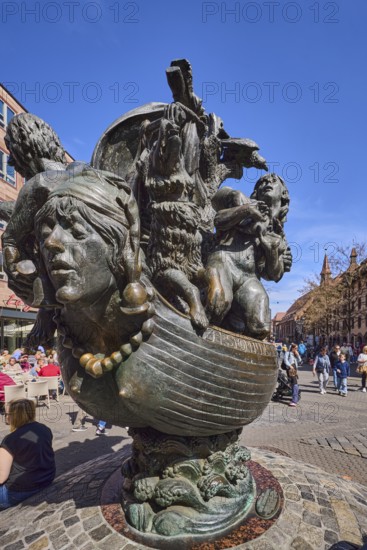 Fool's Ship Fountain, sculptor JÃ¼rgen Weber, fountain with metal sculptures, general architecture, pedestrians as secondary motif, blue sky, cloudless, PlobenhofstraÃŸe, Nuremberg, Middle Franconia, independent city, Bavaria, Germany