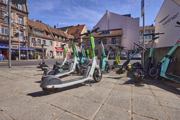 E-scooter in the city, problem, traffic problem, general architecture, pavement, pavement slabs, frog perspective, blue sky, cirrostratus clouds, intersection Grasersgasse with Dr.-Peter-Schönlein-Platz and Klaragasse, Nuremberg, Middle Franconia, independent city, Bavaria, Germany