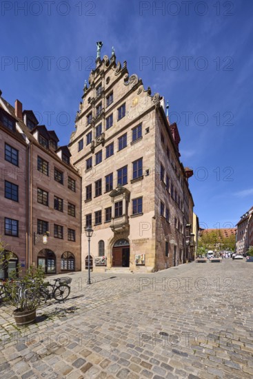 City museum in the Fembo House, historic merchant's house, building, general architecture, street of cobblestones, flower bucket, bicycle, super wide angle, blue sky, cirrostratus clouds, BurgstraÃŸe, Nuremberg, Middle Franconia, independent city, Bavaria, Germany