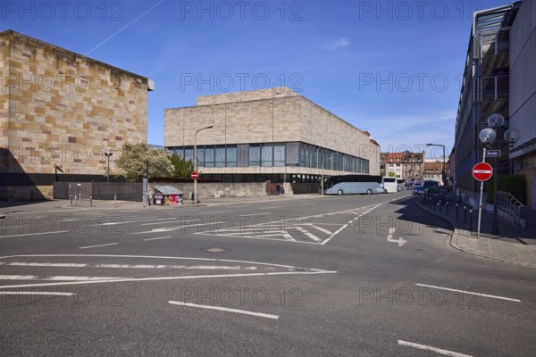 Germanisches National Museum, cultural history museum, modern architecture, building, parking boxes, coach, lantern, roadway, lane markings direction arrow, restricted area, blue sky, cirrostratus clouds, intersection Grasersgasse with Frauentor wall, Nuremberg, Middle Franconia, independent city, Bavaria, Germany