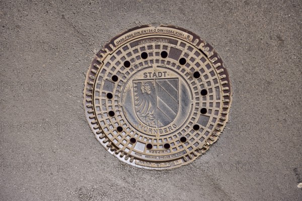 Manhole cover, city coat of arms, drainage, asphalt, road, Nuremberg, Middle Franconia, independent city, Bavaria, Germany
