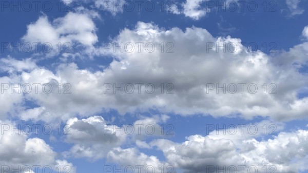 White clouds Altocumulus in front of blue sky. international