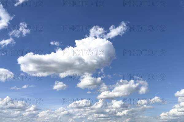 White clouds cumulus heap clouds in front of blue sky, international