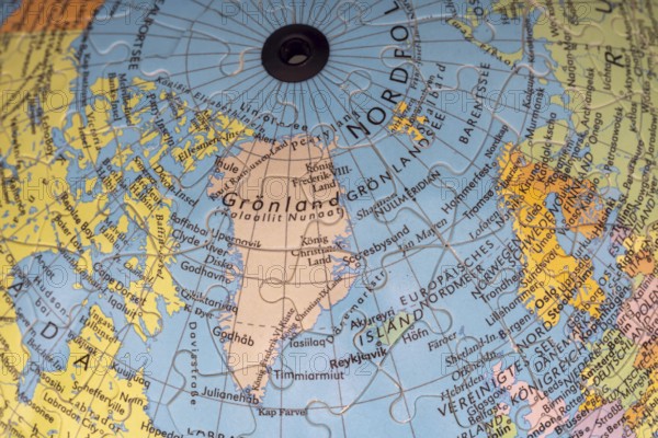 Puzzle globe. Map made from puzzle pieces. Greenland and Denmark