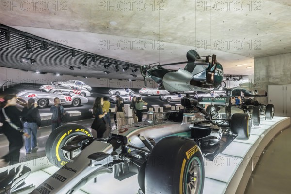The Mercedes-Benz Museum in Stuttgart presents a journey through the automotive history of the global corporation. Myth 7: Racing cars and Silver Arrows - races and records. The history of the Mercedes star begins with the first automobile in 1886. Stuttgart, Baden-WÃ¼rttemberg, Germany