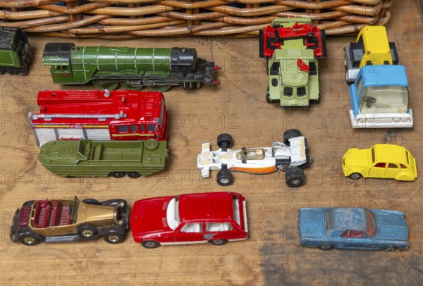 A selection of children's toy cars trucks train for sale on display at auction, UK