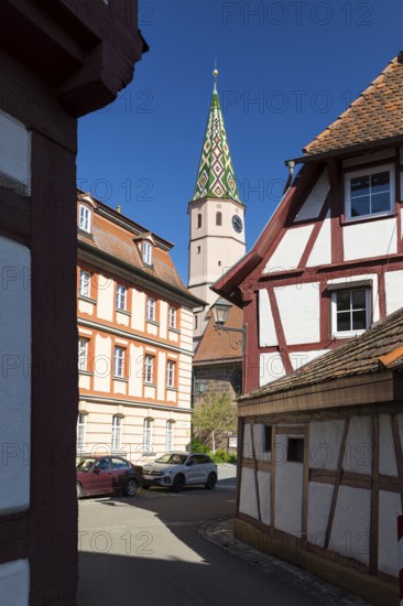 Iron lane with half-timbered houses and church tower of St. Maria am See, also known as Seekapelle, Bad Windsheim, Bavaria, Germany