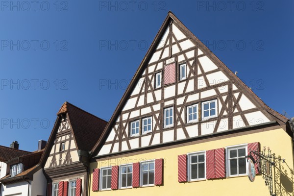 Historic houses with half-timbered gables and shutters in the old town centre of Bad Windsheim, Bavaria, Germany