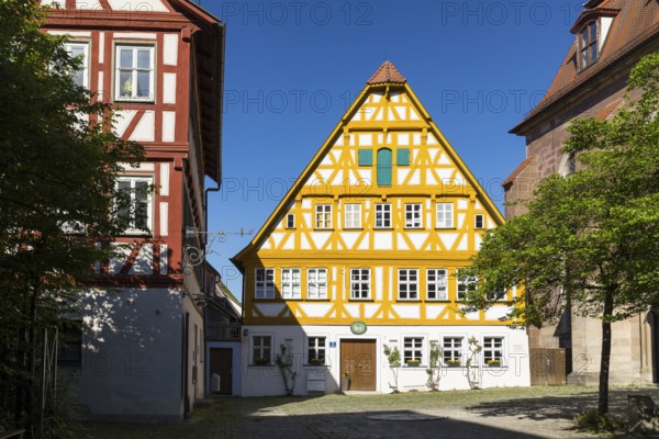 Protestant parish office in historic half-timbered house next to the town church of St Kilian, Bad Windsheim, Bavaria, Germany