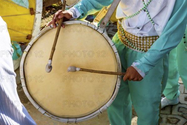 Musicians with their drums and colorful clothes at the typical religious festival of Congado in a quilombo in Minas Gerais, Minas Gerais, Brazil