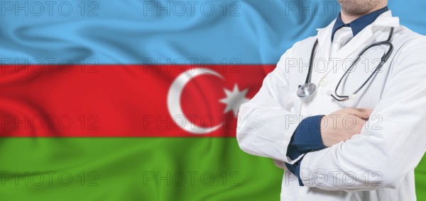 Azerbaijan healthcare concept. Male doctor on Azerbaijan flag. Doctor with crossed arms on Azerbaijan flag