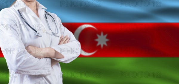 Doctor with crossed arms on Azerbaijan flag. Azerbaijan health and care concept. Female doctor on Azerbaijan flag