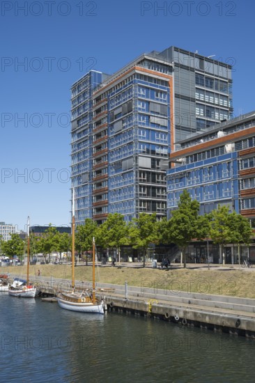 Modern office building and sailing boats at Germaniahafen, museum harbour, Kiel, Kiel Fjord, Baltic Sea, Schleswig-Holstein, Germany