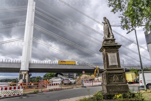 New construction of the motorway bridge Neuenkamp of the A40, over the Rhine near Duisburg, the first bridge is standing, construction of the second bridge, Germania monument on Wilhelmallee North Rhine-Westphalia, Germany