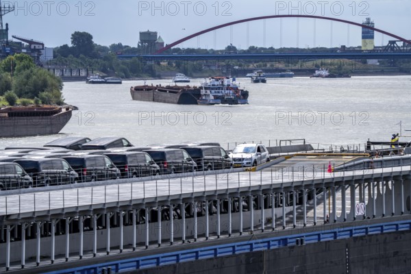 Cargo ships on the Rhine, in the background the Rhine bridge near Duisburg-Rheinhausen, Bridge of Solidarity, Duisburg, North Rhine-Westphalia, Germany