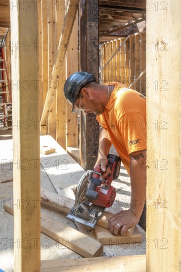 Detroit, Michigan - Jay Newcomb III helps rehab a long-vacant and crumbling commercial building in the Morningside neighborhood. The project, called Ultreia, will contain first floor commercial space and apartments above