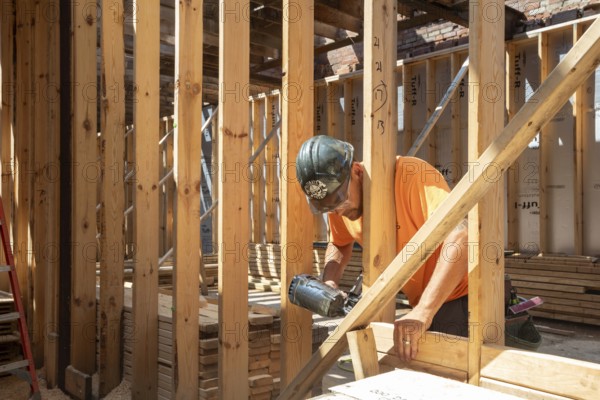 Detroit, Michigan - Jay Newcomb III helps rehab a long-vacant and crumbling commercial building in the Morningside neighborhood. The project, called Ultreia, will contain first floor commercial space and apartments above