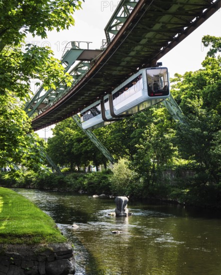A suspension railway at the crash site of Tuffi the elephant. A sculpture of an elephant stands in the Wupper to commemorate the event, Wuppertal, Germany