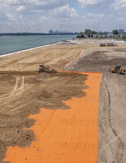 Detroit, Michigan - Workers spread clean dirt after old industrial contamination of cadmium, arsenic, lead, and other metals was removed from A.B. Ford Park on the Detroit River