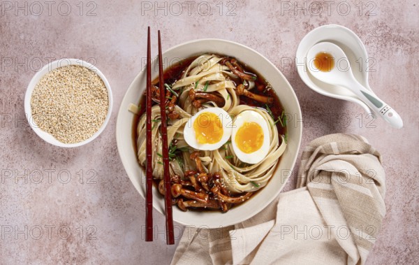 Buckwheat noodles soba with shimeji mushrooms, with boiled egg, green onion, sesame seeds, homemade, without people