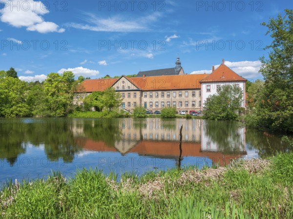 Lamspringe Monastery, reflection in the Lamme pond, Lower Saxony, Germany