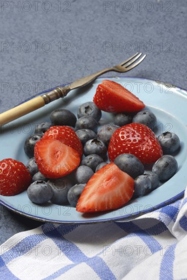 Plate with strawberries and blueberries, Fragaria, Vaccinium