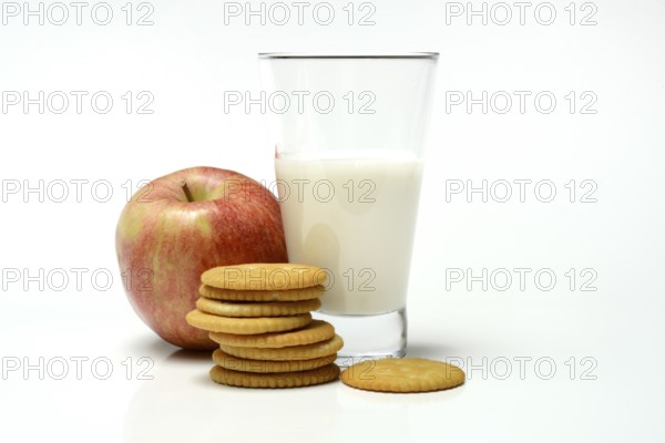 Cracker with glass of milk and apple