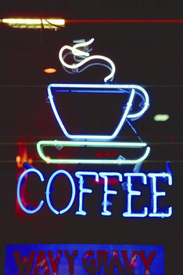 Illuminated advertising at a coffee shop, New York City, USA