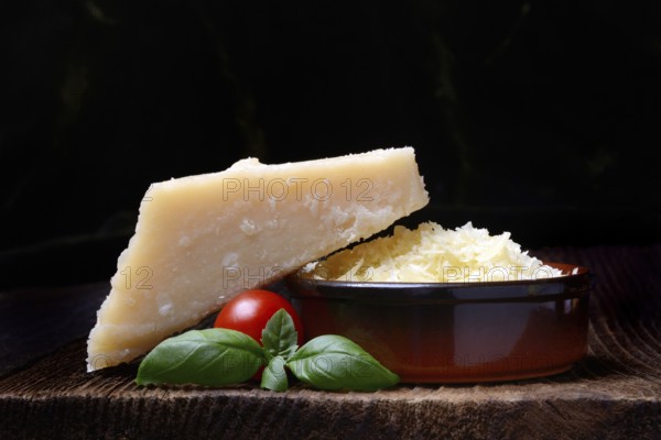 Parmesan cheese, grated cheese in rind and piece of Parmesan, Italy