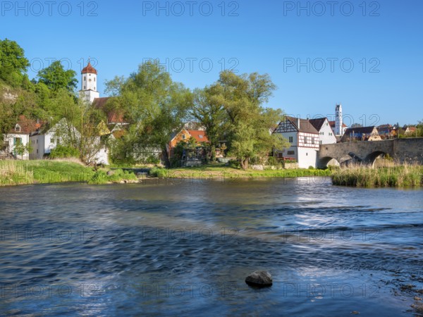View over the river Wörnitz to the old town with the Stone Bridge and the churches of St Barbara and Herz Jesu, Harburg, Donau-Ries, Swabia, Bavaria, Germany